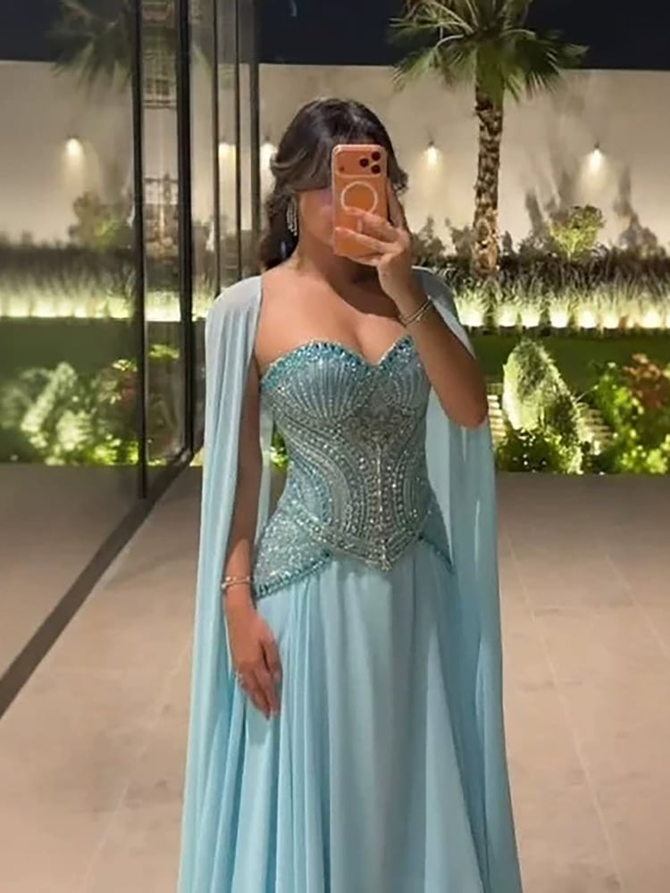 فستان سماوي بكورسيه مطرزه يدوي كرستال