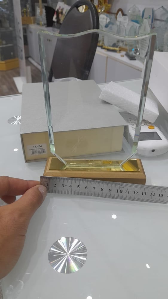 Rectangular crystal shield with beige wooden base