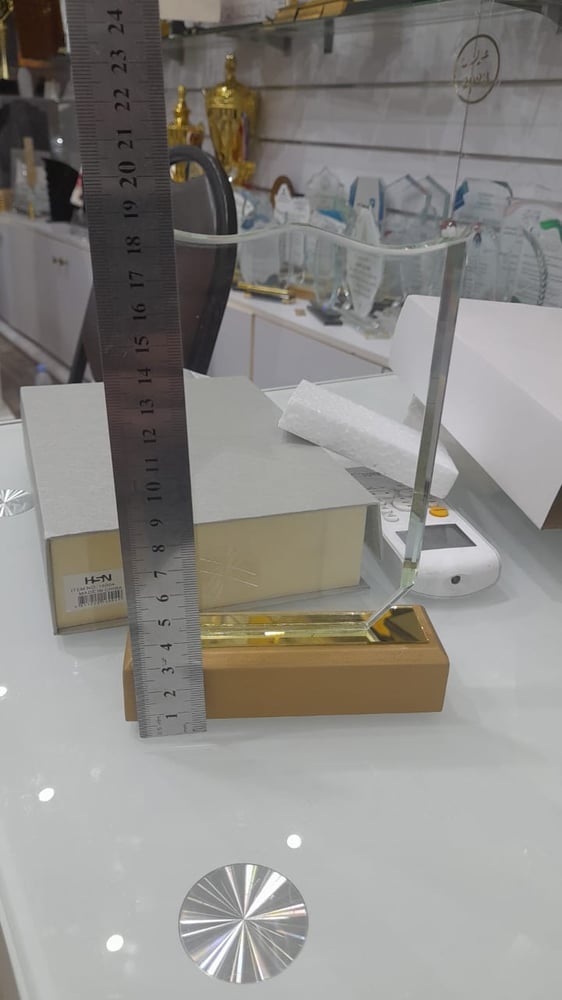 Rectangular crystal shield with beige wooden base