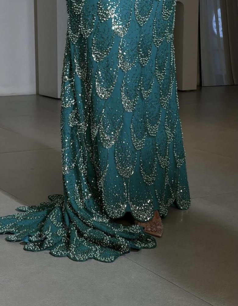Evening dress in an elegant color, made from luxurious tulle fabric, and fully embroidered with pearl beads