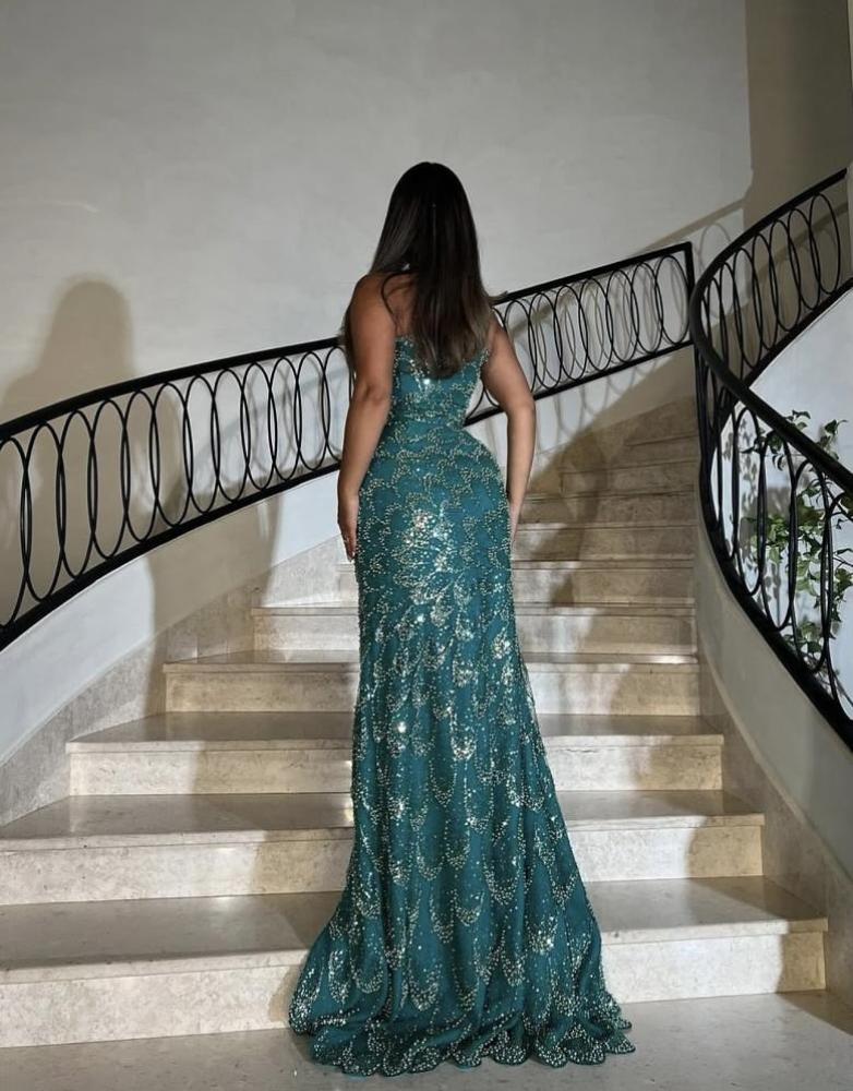 Evening dress in an elegant color, made from luxurious tulle fabric, and fully embroidered with pearl beads