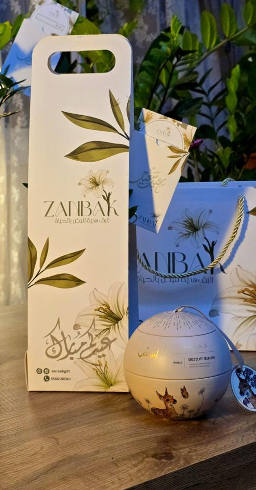 Zamia plant in a glass office container in the middle with chocolate Anoush