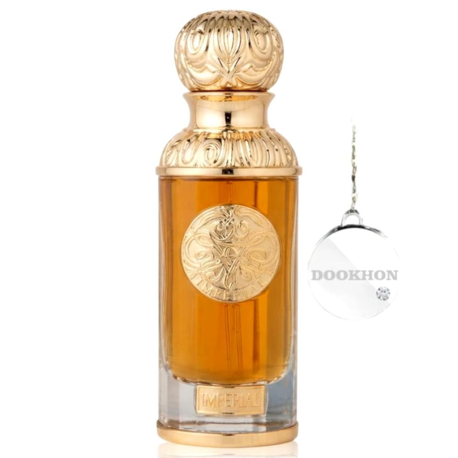 زجاجة عطر إمبريال الفاخرة بتصميمها الأنيق والغطاء الذهبي المنقوش بعناي