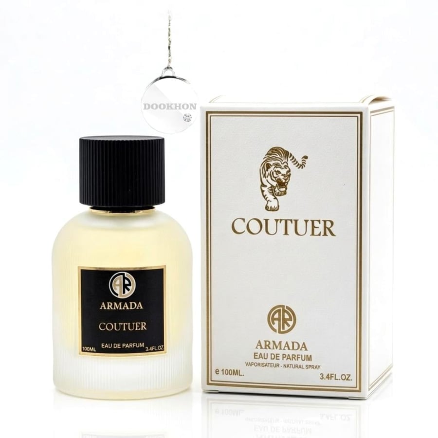 زجاجة عطر كوتور الأنيقة بجانب العلبة البيضاء الفاخرة التي تحمل رسمة ال