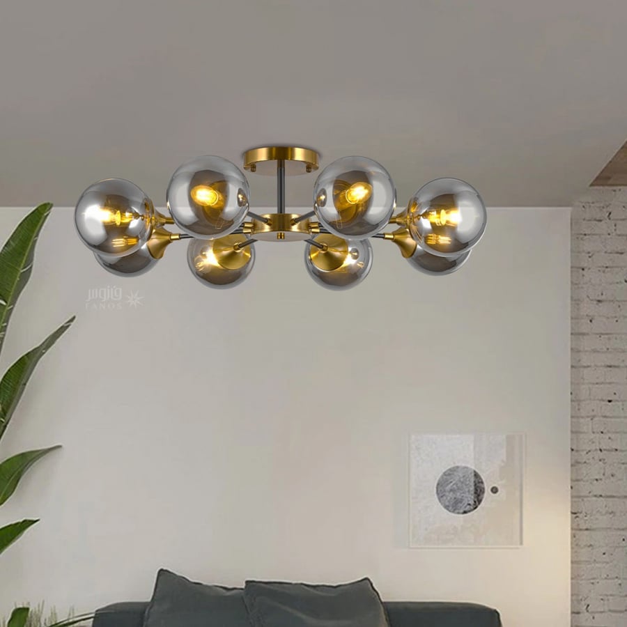 Modern chandelier with gold base and 8 glass balls