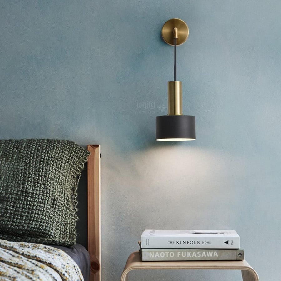 Sophisticated black wall appliqué with a golden base