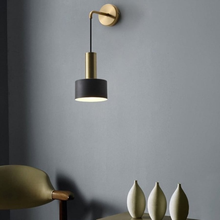 Sophisticated black wall appliqué with a golden base