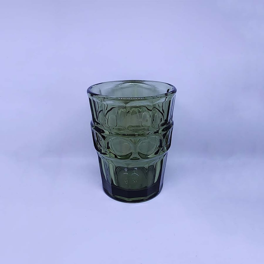 A sturdy glass cup in green color with a prominent design - capacity 240 ml