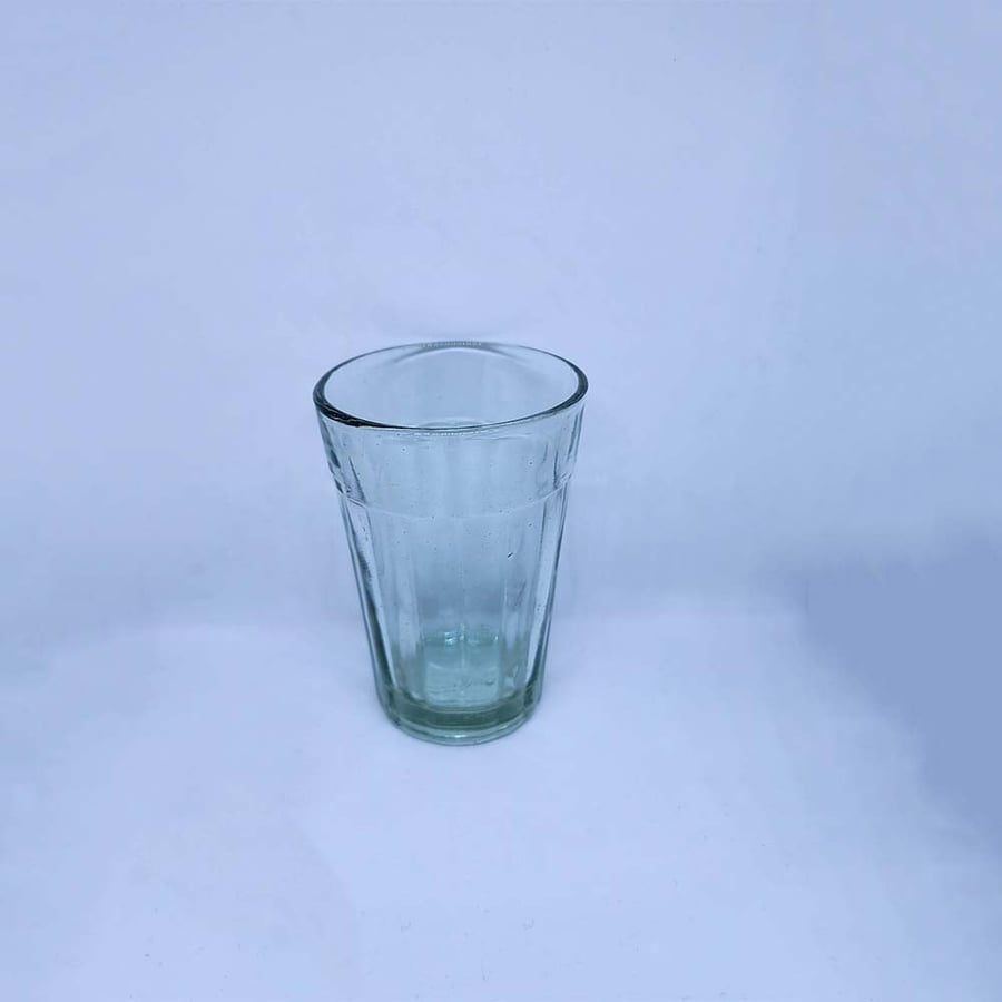 A practical transparent green glass cup - capacity 110 ml
