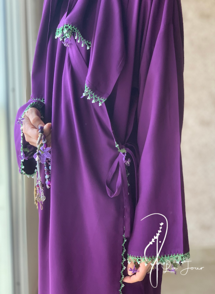Purple prayer shawl decorated with crochet and oya roses