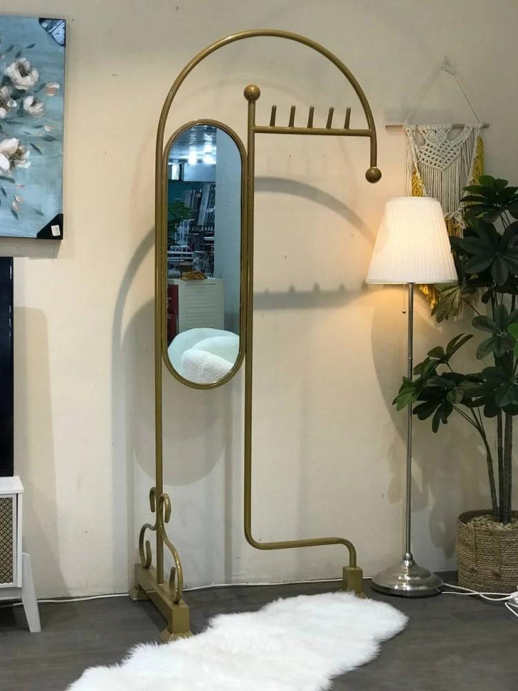 Gold clothing hanger with mirror
