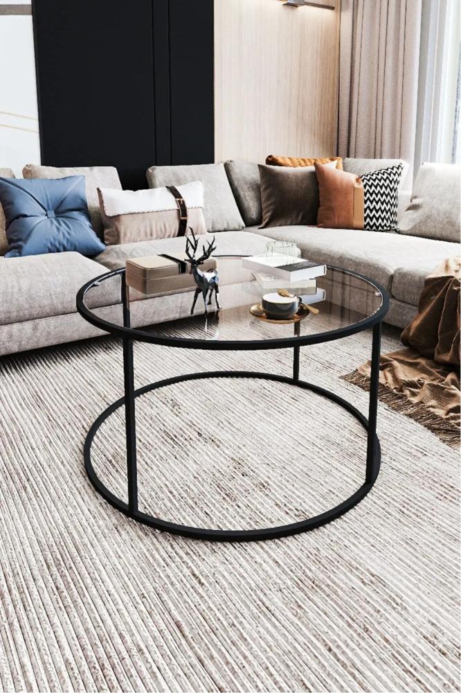 Black iron coffee table with a transparent glass top