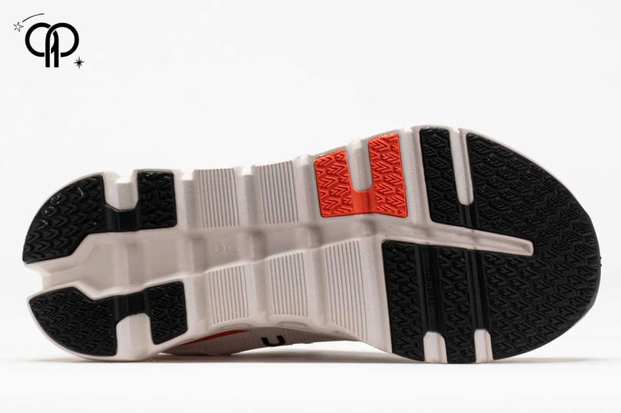 حذاء رجالي اون رانينج كريمي مع اورنج an On Cloudrunner 2 running shoe in the "White & Sand" colorway.