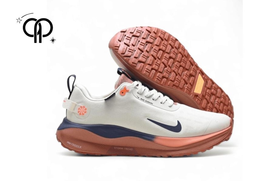 حذاء رجالي نايك ابيض مع اورانج a Nike InfinityRN 4 GORE-TEX men's running shoe in the Sail/Thunder Blue/Total Orange colorway.