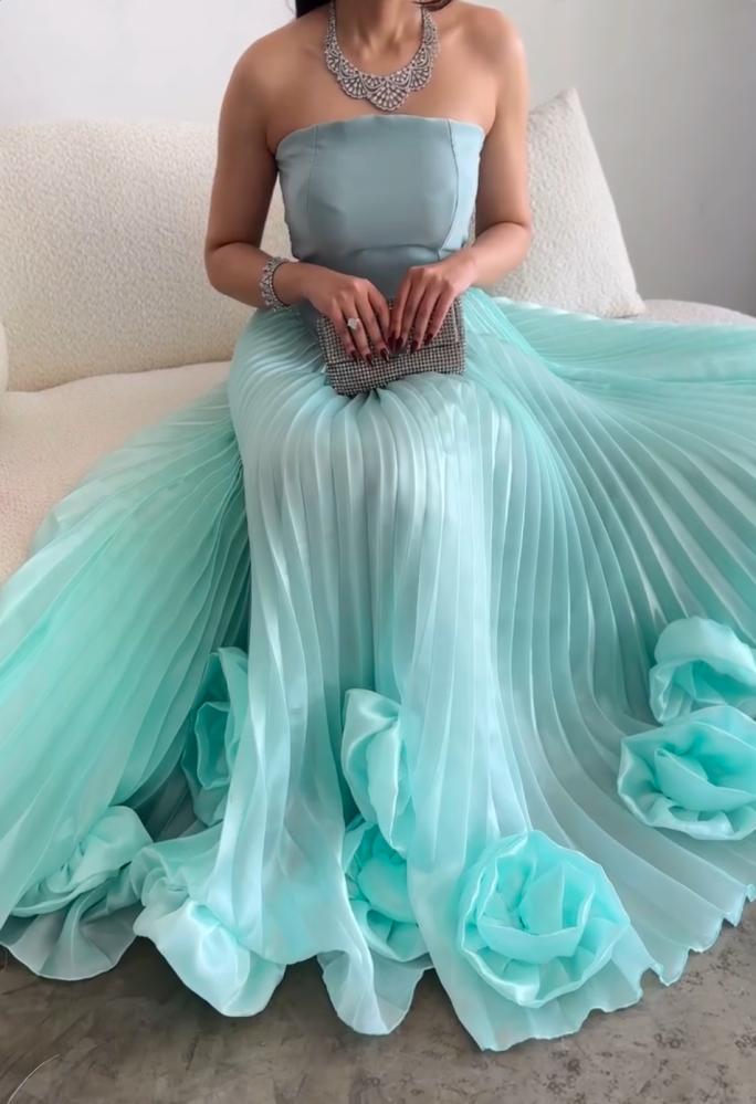 Blue dress decorated with pleats