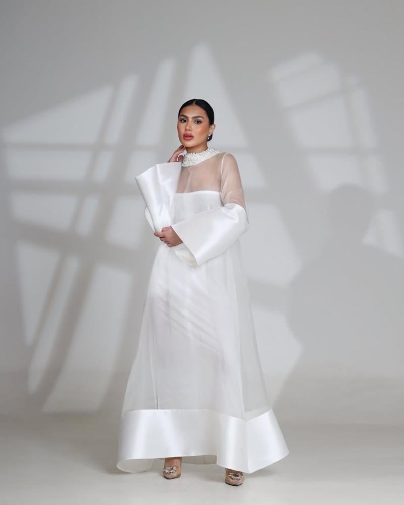 Soft white dress decorated with pearls