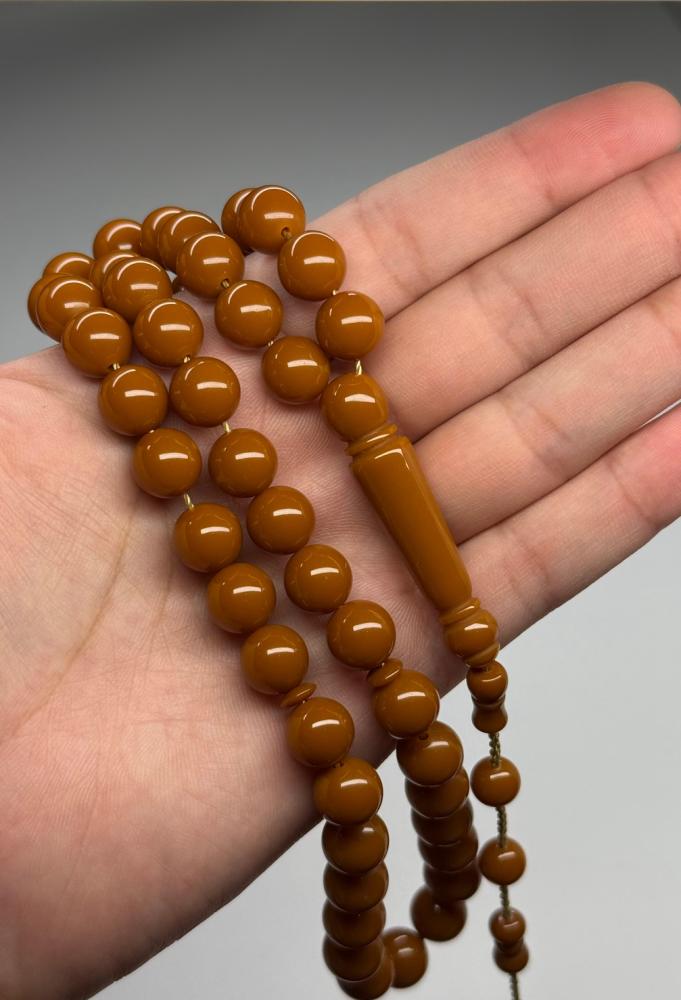 سبحة بكلايت كركوشة باللون الجملي 99 خرزة مقاس 6 في 7 ملي