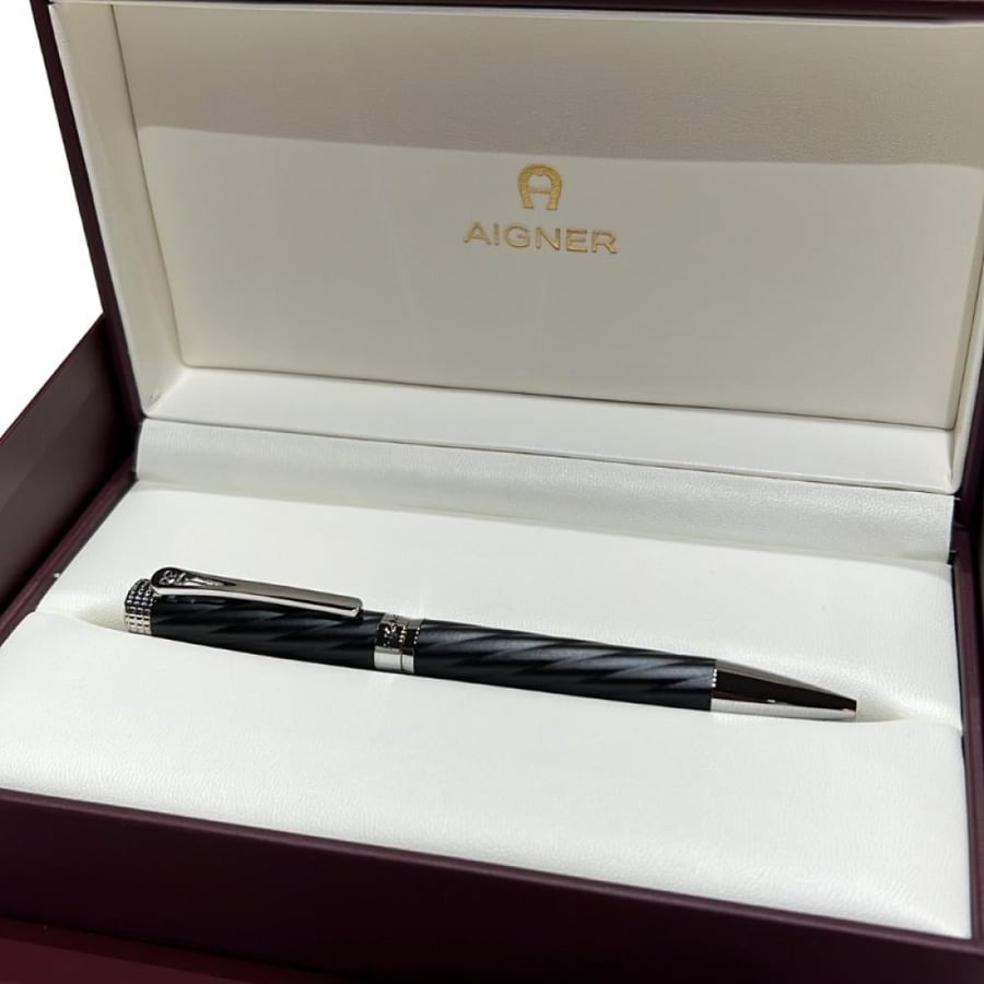 قلم AIGNER الفاخر باللون الأسود والمعدن الفضي مع تصميم حلزوني أنيق