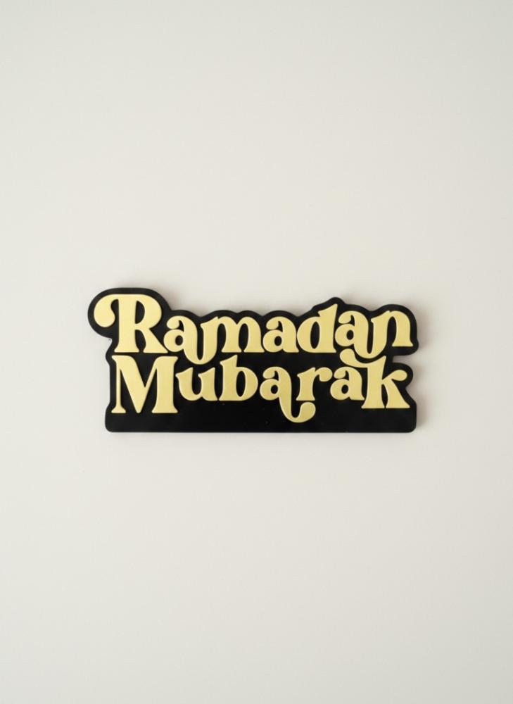 Ramadan Mubarak phrase in English for table decor with elegant Islamic design