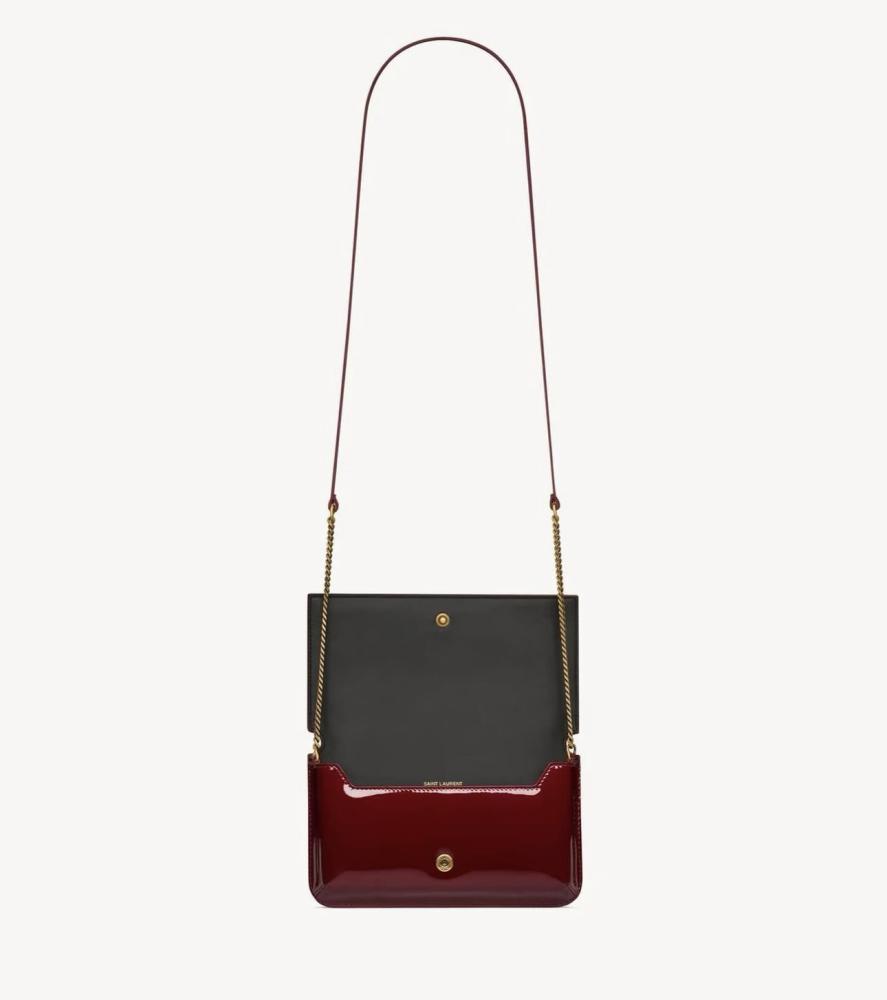 Red shiny bag from YSL with all accessories