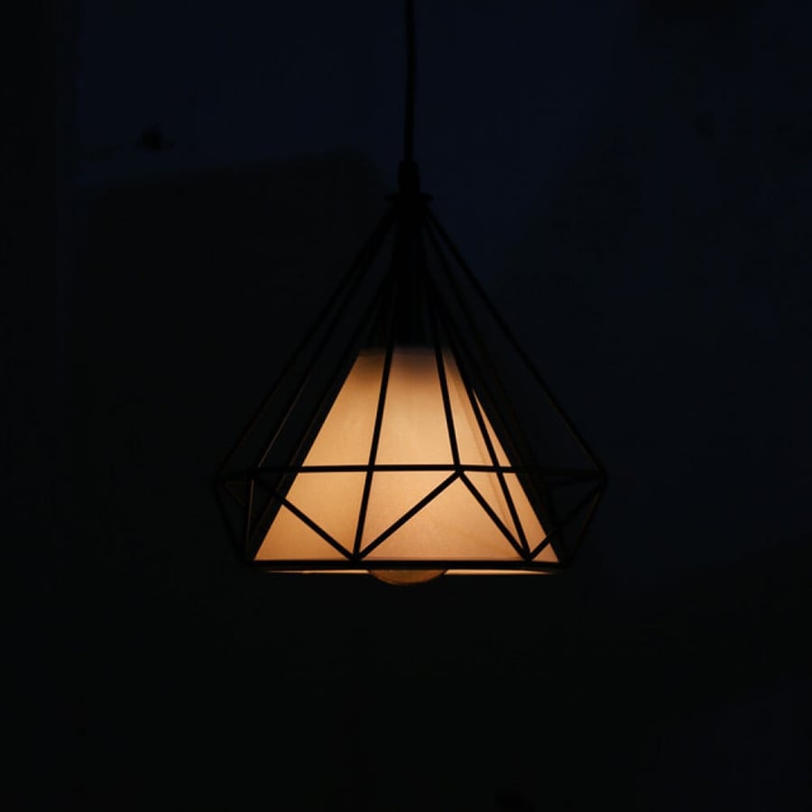 Hanging chandelier with a shiny pyramidal black structure