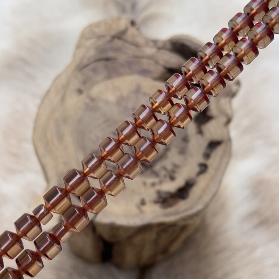 Saffron-colored rosary - a distinctive color