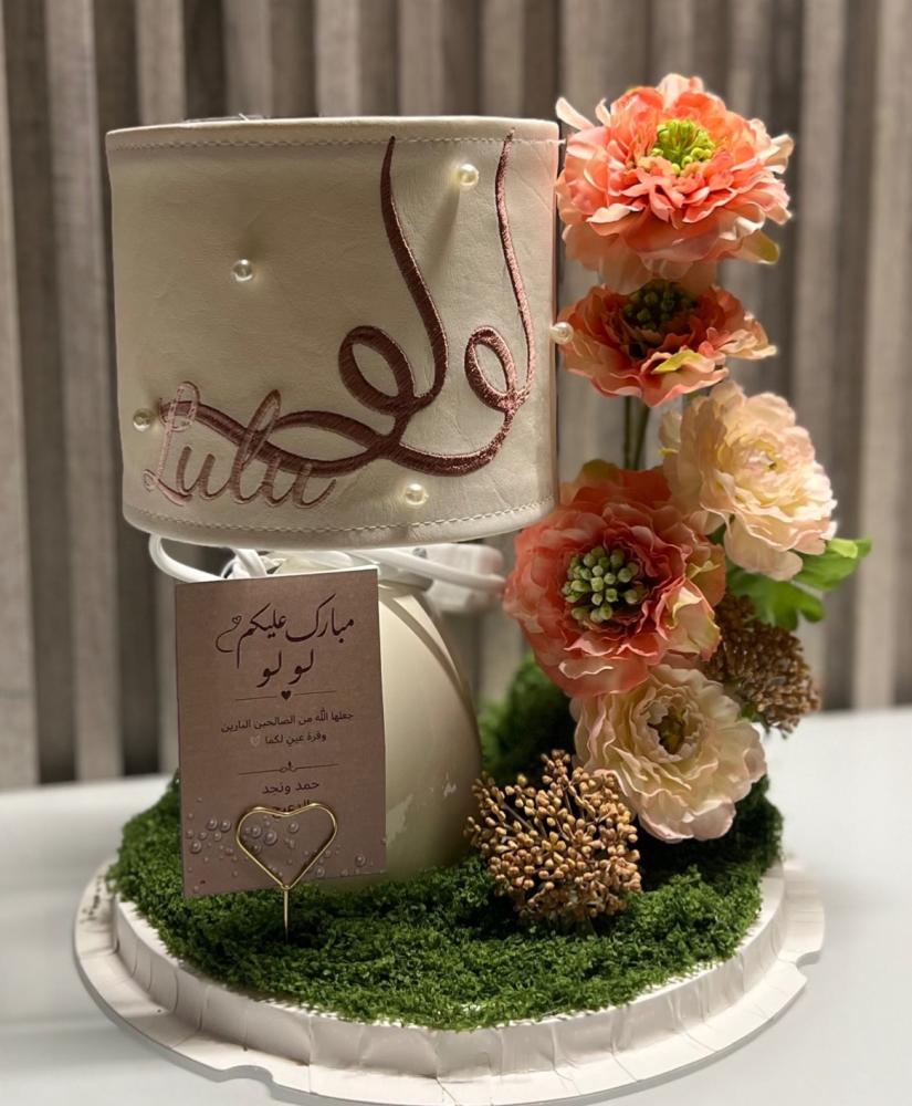 Name-embroidered lamp