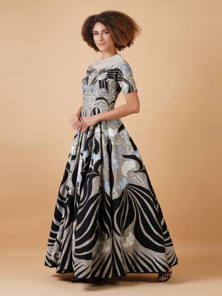 Featured here is a high-neck fit, A-line floor length gown 228