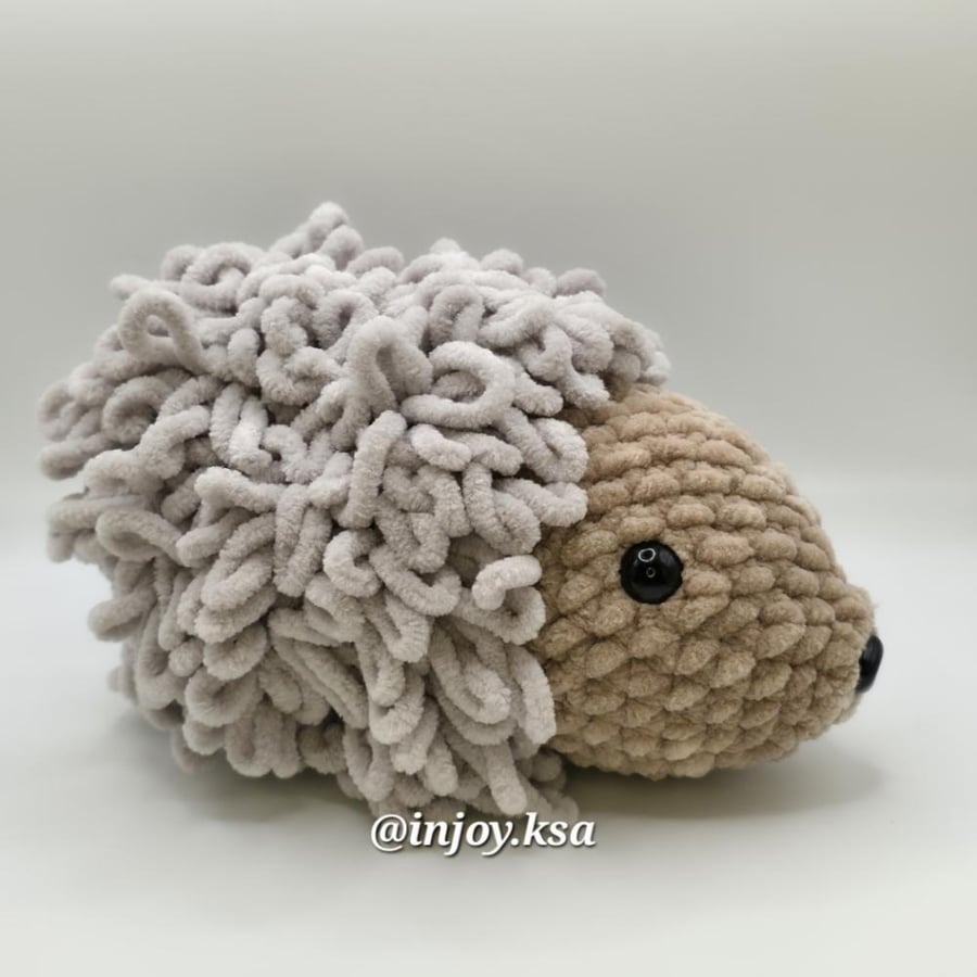 My friend is a crochet hedgehog doll, Amigurumi (brown head, gray body)