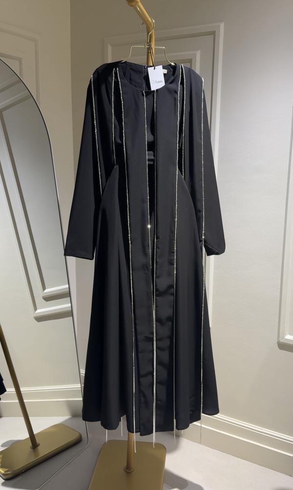 A luxurious black royal dress with embroidered details
