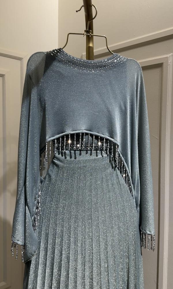 Sky-colored long dress with crystal eyelashes