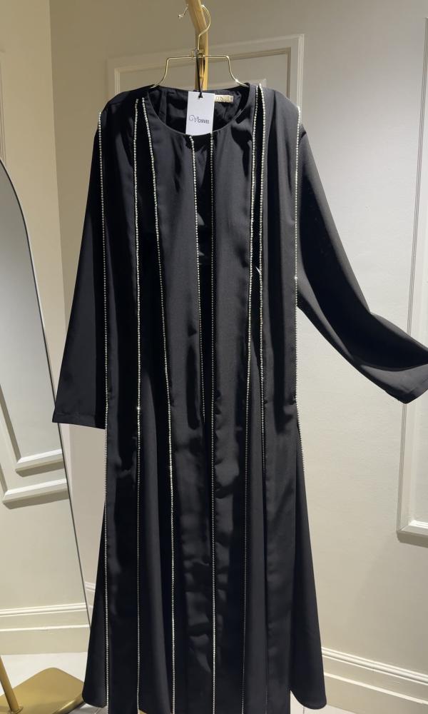 A luxurious black royal dress with embroidered details