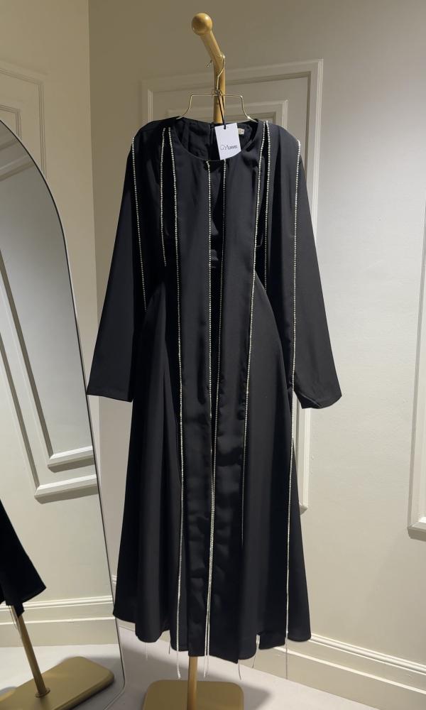 A luxurious black royal dress with embroidered details