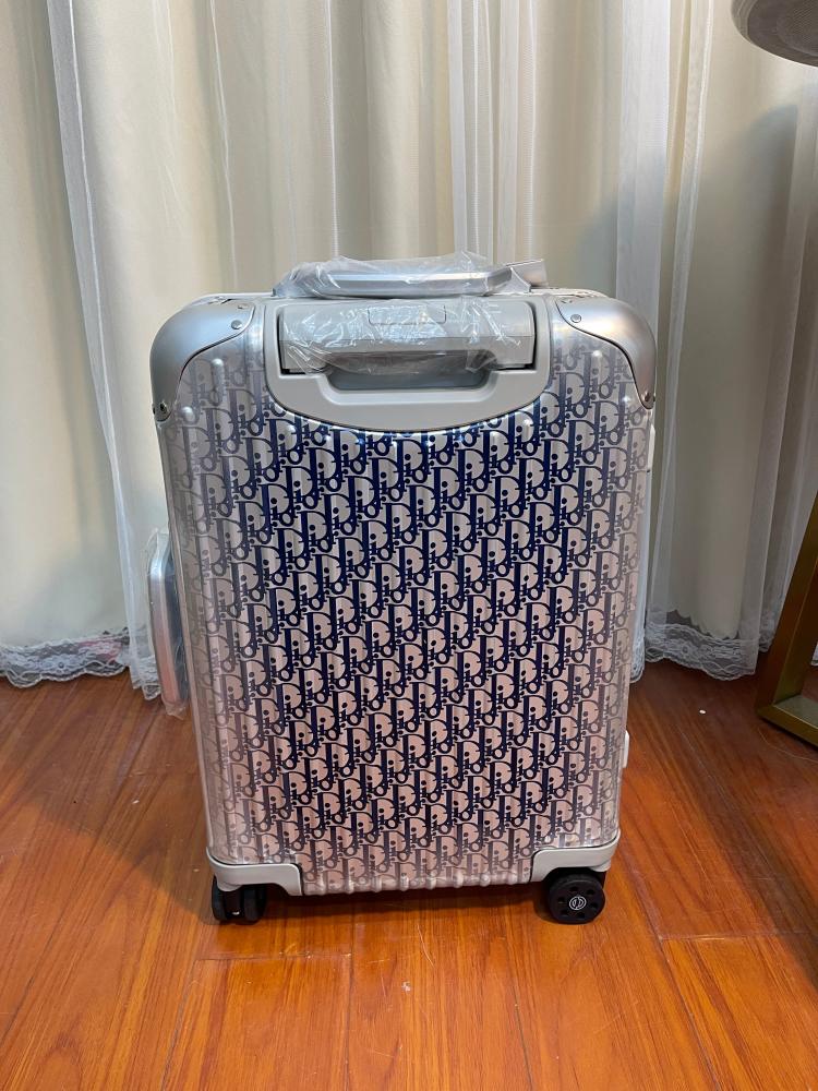 حقيبة سفر X RIMOWA من ديور - فضي وكحلي