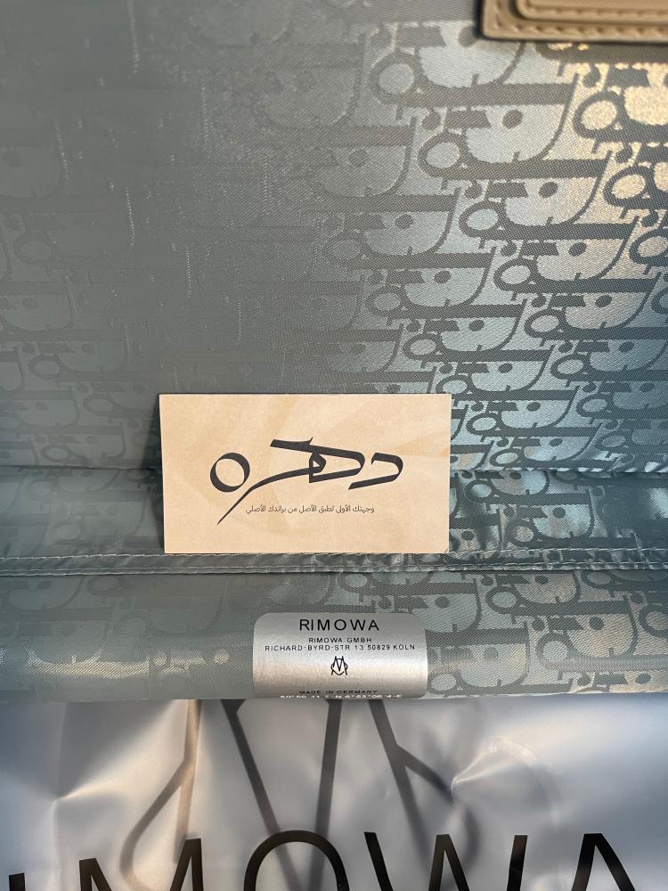 حقيبة سفر X RIMOWA من ديور - فضي وكحلي