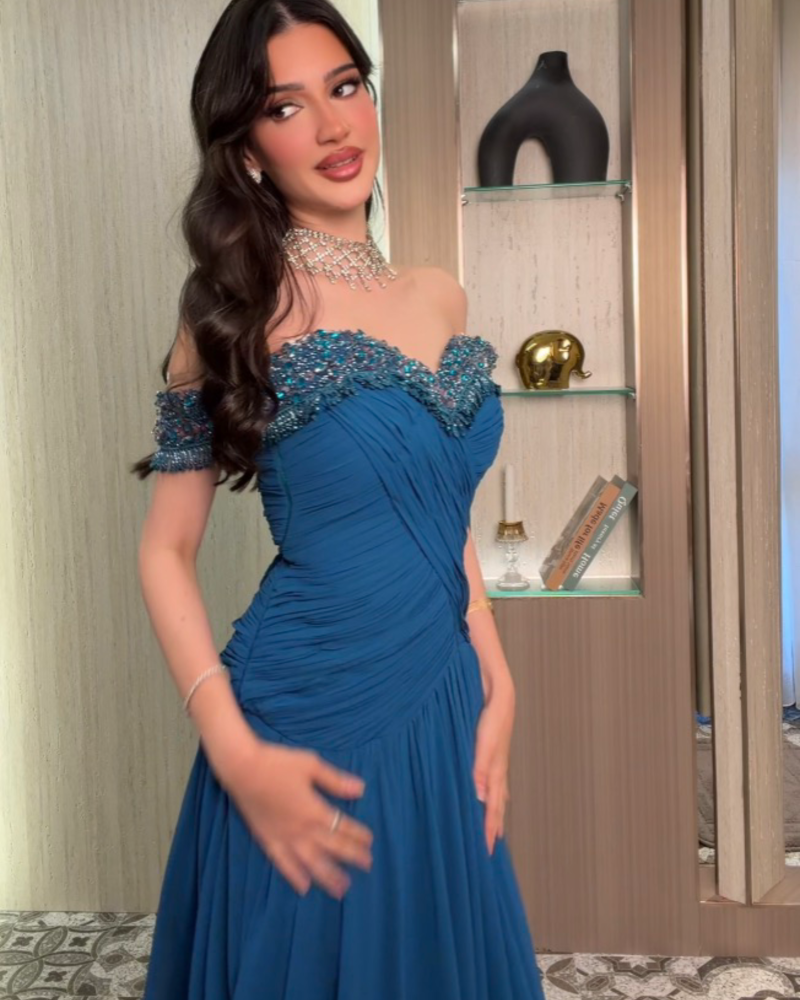 فستان سهرة أزرق بترولي
