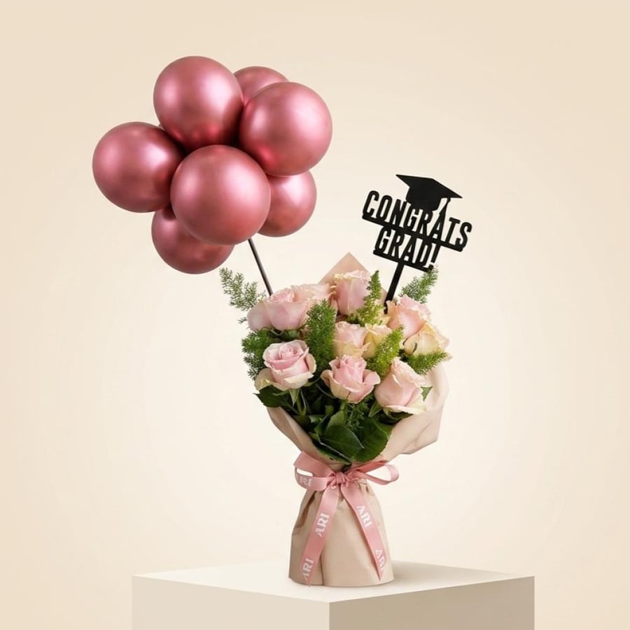 Pink graduation bouquet with balloons