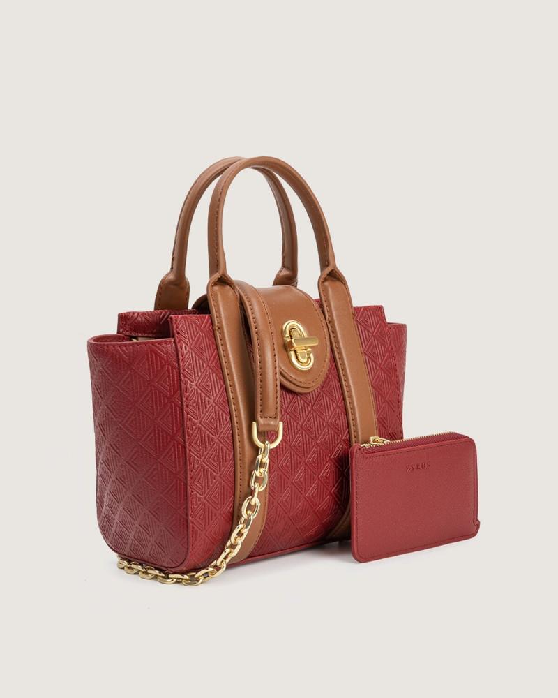 Women's bag with a practical design and a suitable size for everyday use, in a burgundy color.