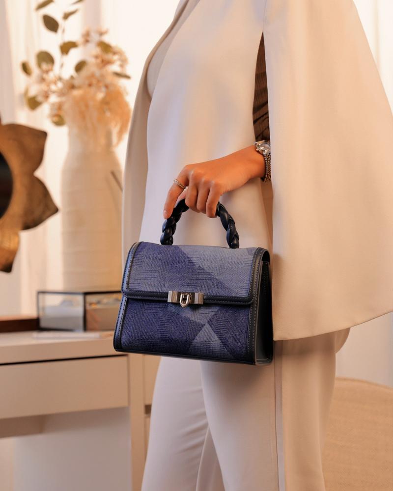 Women's handbag with a modern design in blue