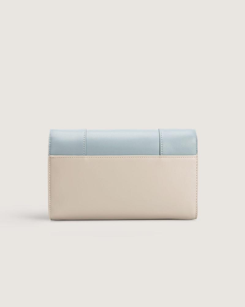 Women's leather handbag in blue and beige