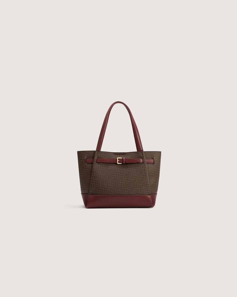 A spacious, practical women's bag in a burgundy color.