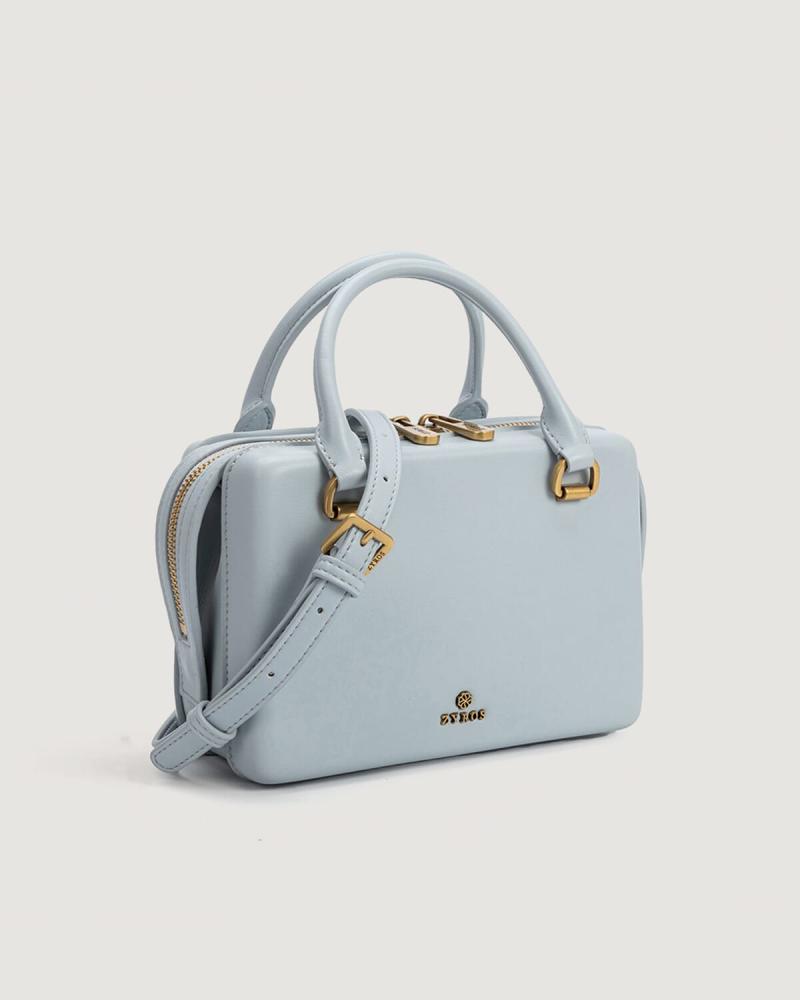 Women's handbag with an elegant design in light blue