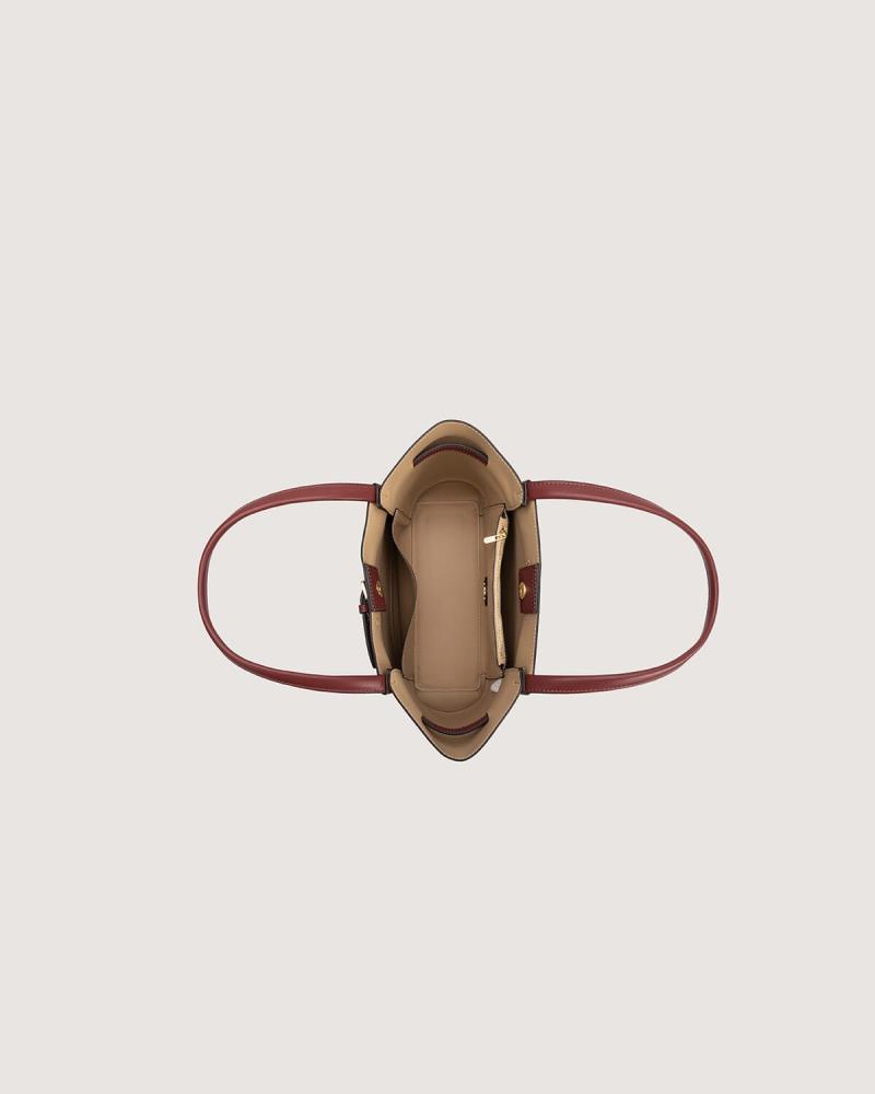 A spacious, practical women's bag in a burgundy color.