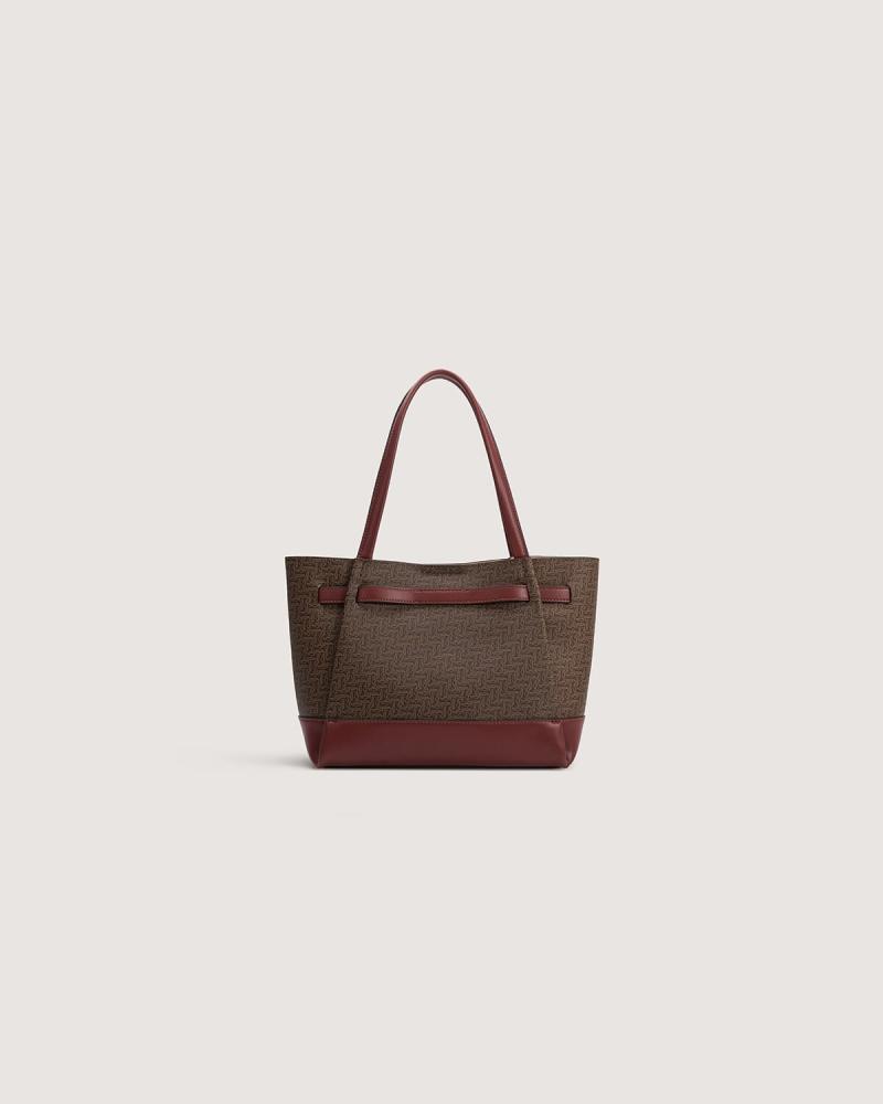A spacious, practical women's bag in a burgundy color.