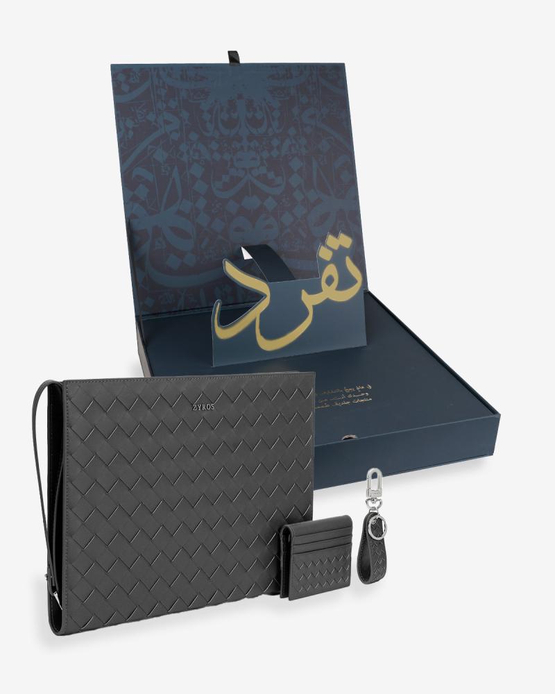 Luxury set including bag, keychain, and wallet in black