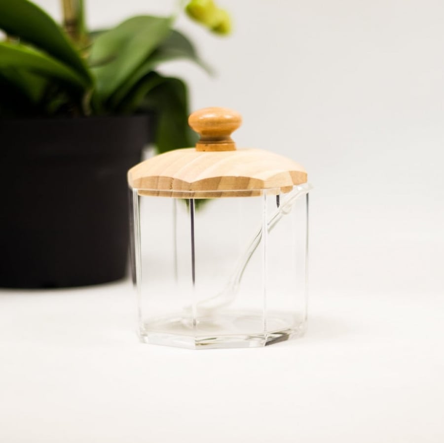 Acrylic cup with a wooden spoon and lid