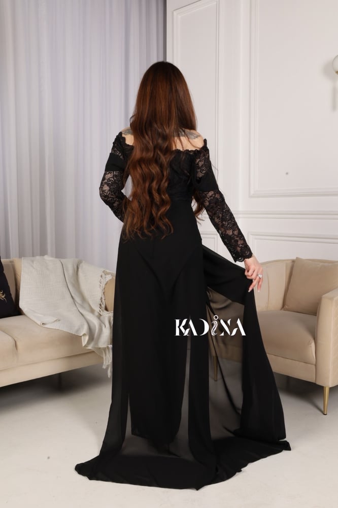 Black evening dress with chiffon sleeves and slit from the bottom