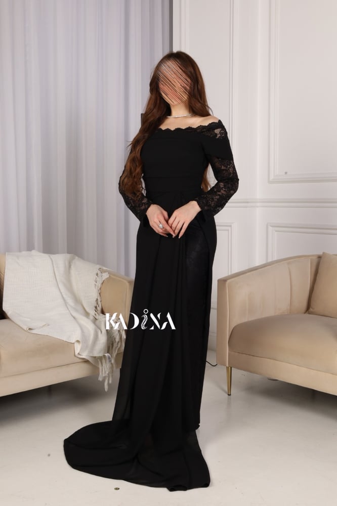 Black evening dress with chiffon sleeves and slit from the bottom