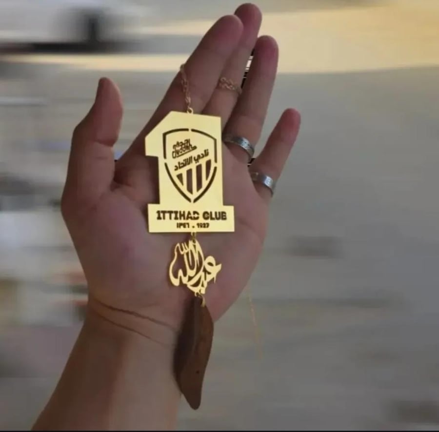 Car pendant of Al-Ittihad Club with a broken stick