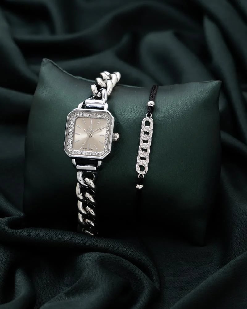 A watch and bracelet set in silver color